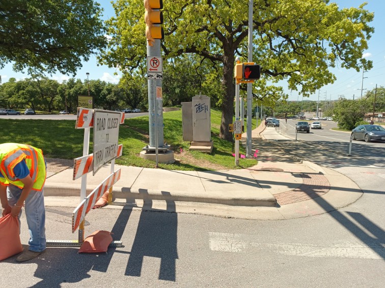 GBC crew setting up a road closure at an Austin intersection